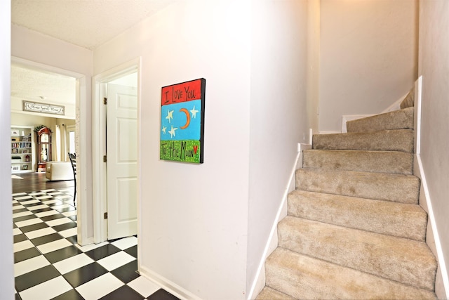 6311 Country Ln, Pine Bluff, AR 71603 - stairs with tile patterned floors and baseboards