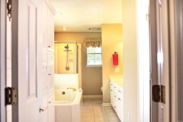6311 Country Ln, Pine Bluff, AR 71603 - full bath with tile patterned flooring, a garden tub, vanity, toilet, and baseboards