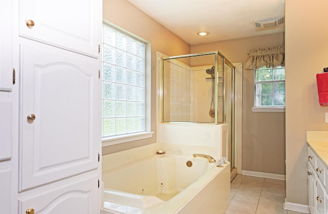 6311 Country Ln, Pine Bluff, AR 71603 - bathroom featuring vanity, plenty of natural light, a stall shower, and tile patterned flooring