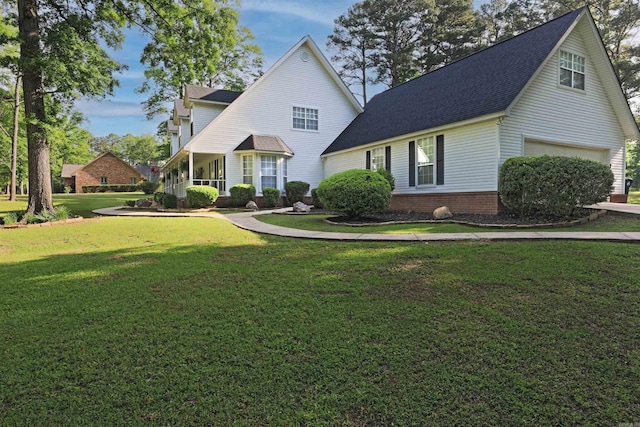 6311 Country Ln, Pine Bluff, AR 71603 - view of front of house with a garage, roof with shingles, and a front lawn