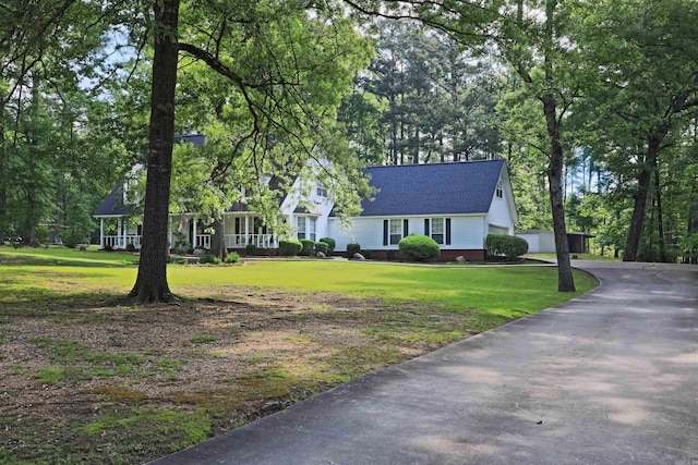 6311 Country Ln, Pine Bluff, AR 71603 - view of front facade featuring a front lawn, roof with shingles, driveway, and crawl space