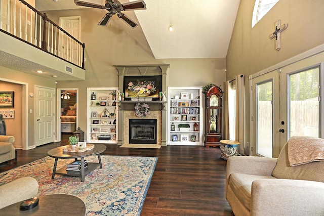6311 Country Ln, Pine Bluff, AR 71603 - living room featuring a fireplace with flush hearth, high vaulted ceiling, ceiling fan, and wood finished floors
