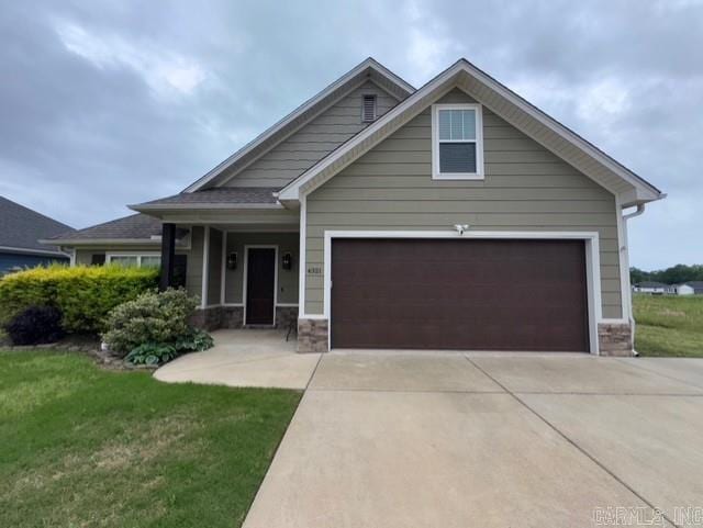 4321 Sloan, Alexander, AR 72002 - craftsman-style home featuring a front lawn, stone siding, and concrete driveway