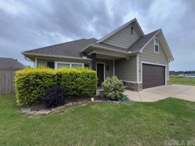 4321 Sloan, Alexander, AR 72002 - craftsman inspired home featuring a garage, fence, a front lawn, concrete driveway, and a shingled roof