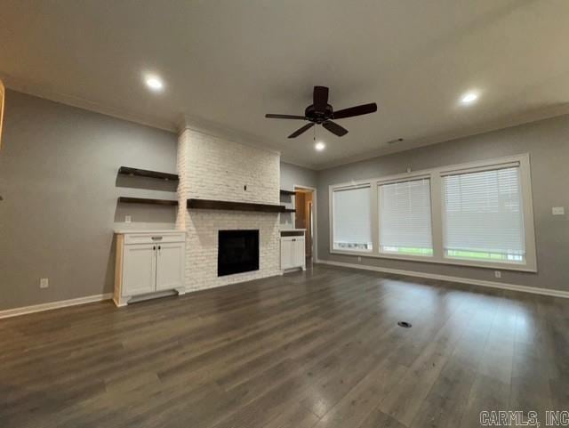 4321 Sloan, Alexander, AR 72002 - unfurnished living room featuring a brick fireplace, a ceiling fan, baseboards, recessed lighting, and dark wood-style floors