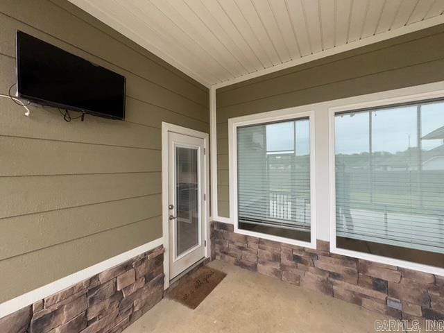 4321 Sloan, Alexander, AR 72002 - doorway to property featuring stone siding