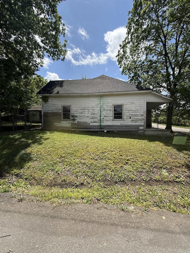 view of home's exterior featuring a lawn