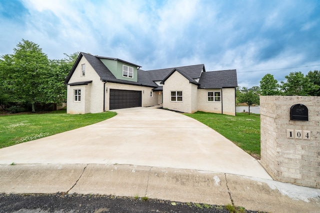 modern farmhouse featuring concrete driveway, roof with shingles, a front yard, and a garage