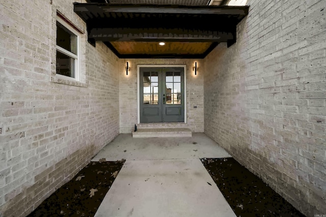 property entrance featuring french doors