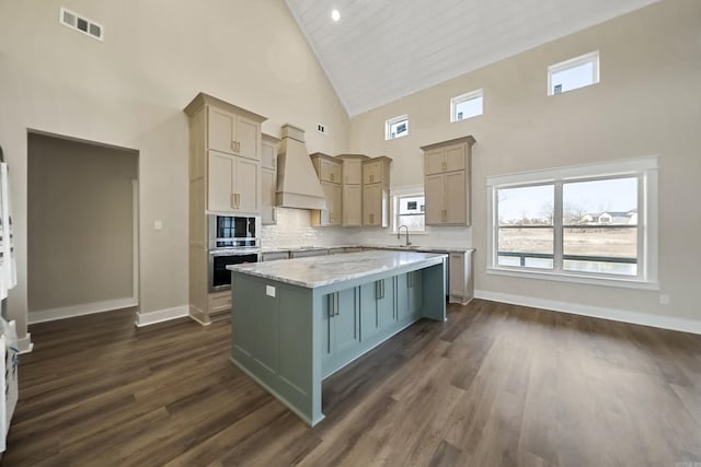 kitchen with dark wood-style flooring, high vaulted ceiling, a center island, stainless steel appliances, and custom range hood