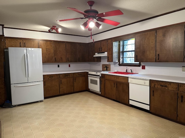 kitchen with ceiling fan, a sink, light countertops, under cabinet range hood, and white appliances