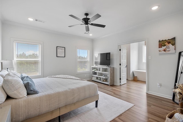 bedroom featuring visible vents, ornamental molding, wood finished floors, baseboards, and recessed lighting