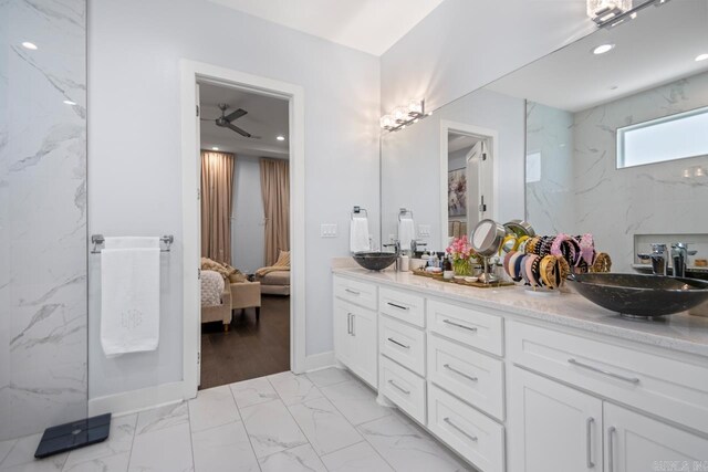702 Wildcreek Cir, Little Rock, AR 72223 - bathroom with double vanity, ensuite bathroom, a sink, and marble finish floor