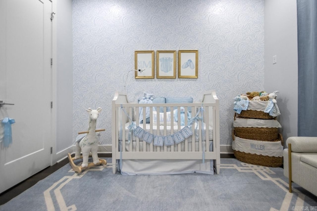 702 Wildcreek Cir, Little Rock, AR 72223 - bedroom with a crib, baseboards, wallpapered walls, and carpet floors