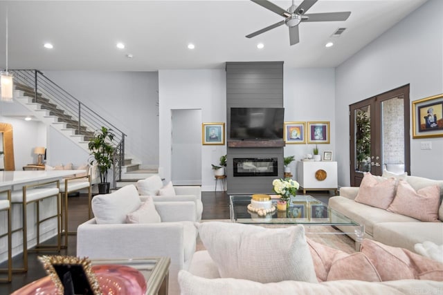 702 Wildcreek Cir, Little Rock, AR 72223 - living area featuring dark wood-style flooring, stairs, recessed lighting, a ceiling fan, and visible vents