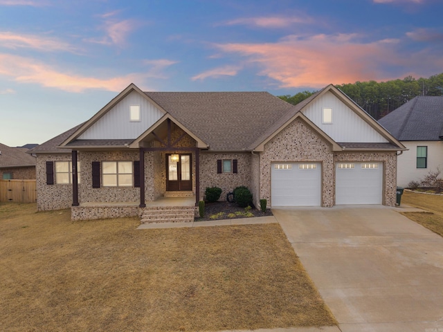 1910 Pecan Crk, Conway, AR 72034 - single story home featuring a shingled roof, a front lawn, brick siding, a garage, and concrete driveway