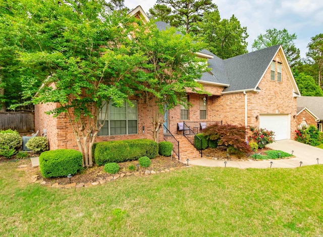 2820 Mossy Creek Dr, Little Rock, AR 72211 - view of front of property with a garage, a front lawn, covered porch, brick siding, and concrete driveway