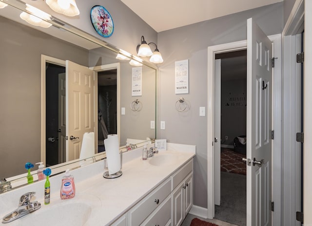 2820 Mossy Creek Dr, Little Rock, AR 72211 - full bathroom with double vanity, baseboards, and a sink