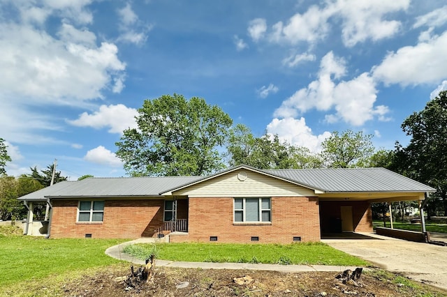 320 Church, Weiner, AR 72479 - view of front of home featuring a front lawn, brick siding, crawl space, concrete driveway, and a carport