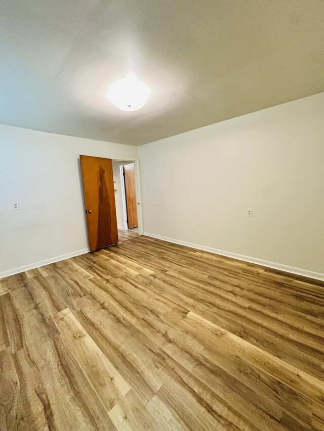 320 Church, Weiner, AR 72479 - empty room featuring baseboards and wood finished floors