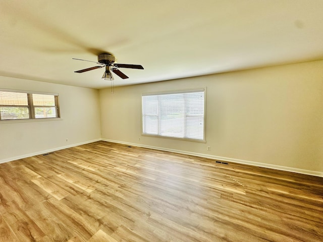 320 Church, Weiner, AR 72479 - spare room with a ceiling fan, baseboards, visible vents, and wood finished floors
