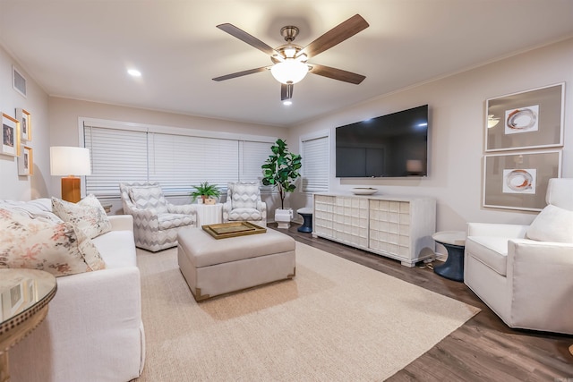 living room with a ceiling fan, recessed lighting, wood finished floors, and visible vents