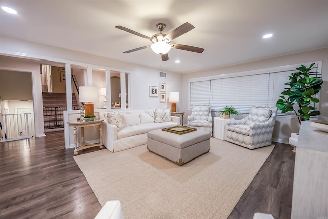 living area featuring ceiling fan, recessed lighting, wood finished floors, visible vents, and stairway