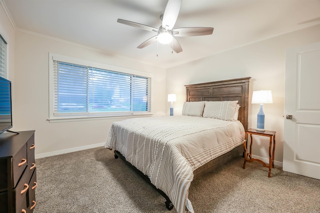 bedroom with baseboards, ornamental molding, a ceiling fan, and carpet flooring