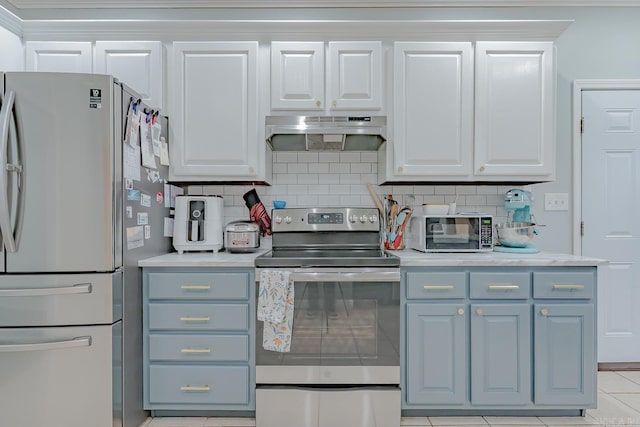 1010 Brownstone Dr, Jonesboro, AR 72404 - kitchen featuring white cabinets, light countertops, stainless steel appliances, tasteful backsplash, and under cabinet range hood