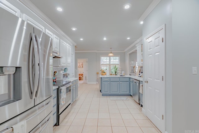 1010 Brownstone Dr, Jonesboro, AR 72404 - kitchen with crown molding, appliances with stainless steel finishes, light countertops, a peninsula, and light tile patterned floors