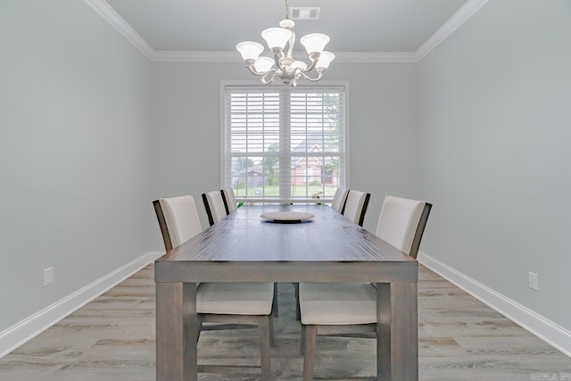 1010 Brownstone Dr, Jonesboro, AR 72404 - dining space with visible vents, ornamental molding, a healthy amount of sunlight, and an inviting chandelier