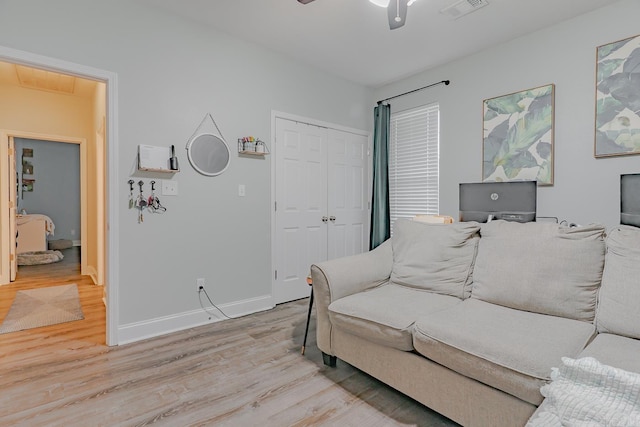 1010 Brownstone Dr, Jonesboro, AR 72404 - living room with baseboards, ceiling fan, visible vents, and light wood-style flooring