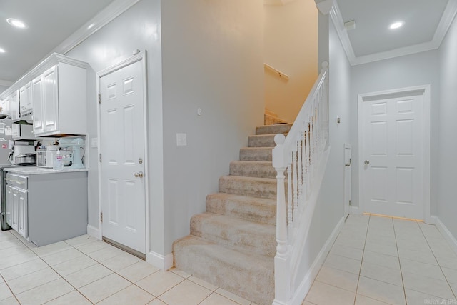 1010 Brownstone Dr, Jonesboro, AR 72404 - stairs with crown molding, recessed lighting, tile patterned floors, and baseboards
