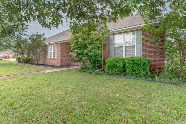 1010 Brownstone Dr, Jonesboro, AR 72404 - ranch-style house featuring brick siding, a front yard, and roof with shingles