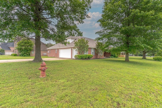 1010 Brownstone Dr, Jonesboro, AR 72404 - traditional-style house featuring an attached garage, concrete driveway, a front lawn, and brick siding