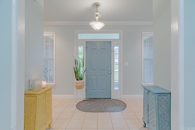 1010 Brownstone Dr, Jonesboro, AR 72404 - foyer entrance featuring crown molding, baseboards, and light tile patterned floors