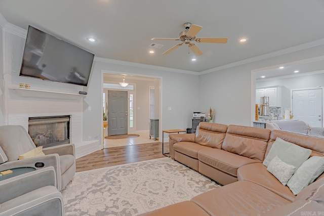 1010 Brownstone Dr, Jonesboro, AR 72404 - living room featuring crown molding, recessed lighting, a ceiling fan, and wood finished floors