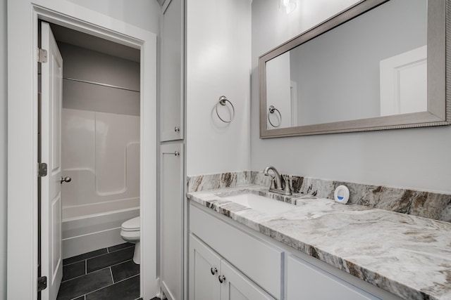 full bathroom featuring vanity,  shower combination, tile patterned flooring, and toilet