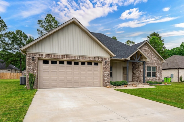 view of front of house with brick siding, driveway, and a front yard