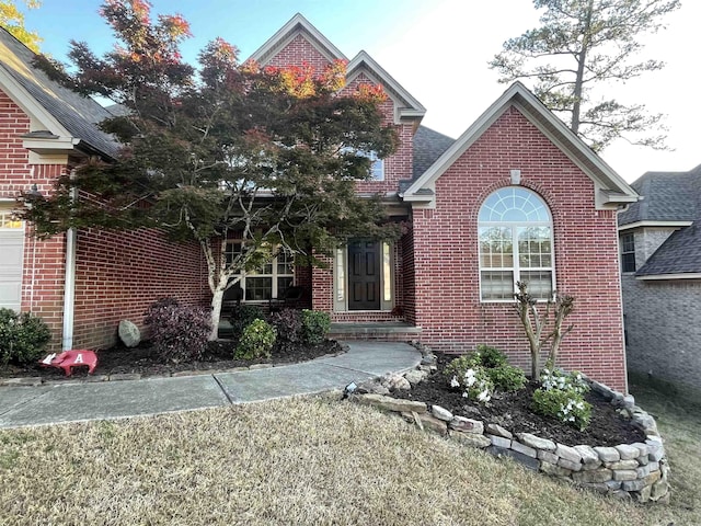 view of front facade featuring brick siding