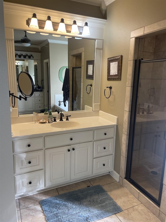 full bath with vanity, ornamental molding, and a stall shower