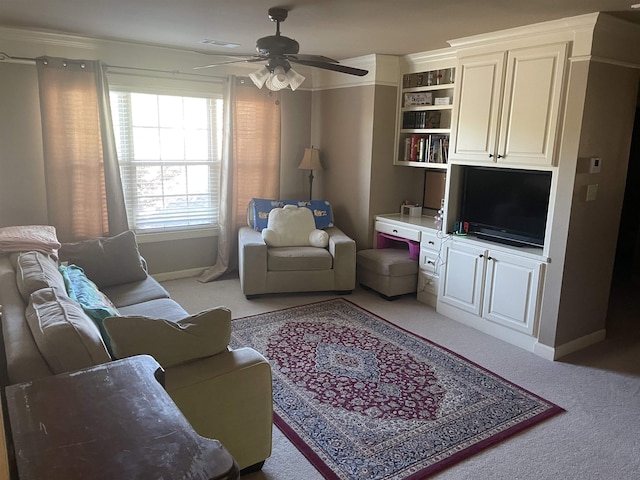 living area featuring ceiling fan, light colored carpet, and baseboards