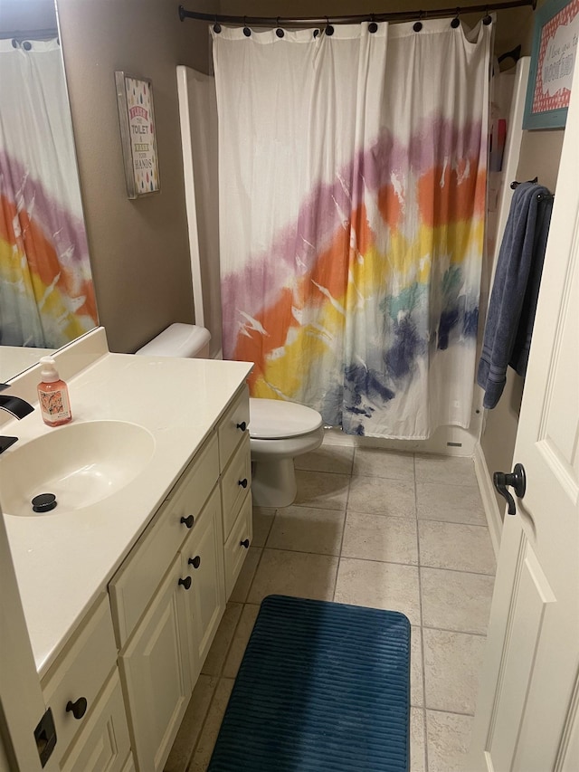 full bathroom featuring vanity, tile patterned flooring, a shower with curtain, and toilet