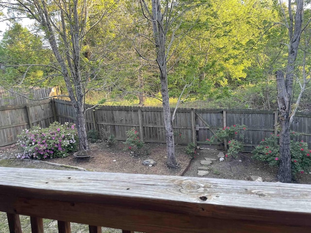 deck with a fenced backyard