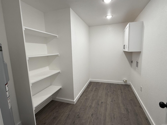 laundry area with electric dryer hookup, dark wood finished floors, cabinet space, baseboards, and hookup for a washing machine