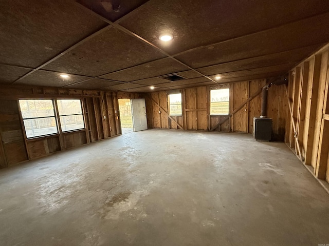 misc room featuring unfinished concrete floors and plenty of natural light