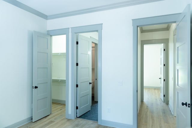 100 Laurie Dr, Mena, AR 71953 - unfurnished bedroom with light wood-style floors, baseboards, a closet, and a spacious closet