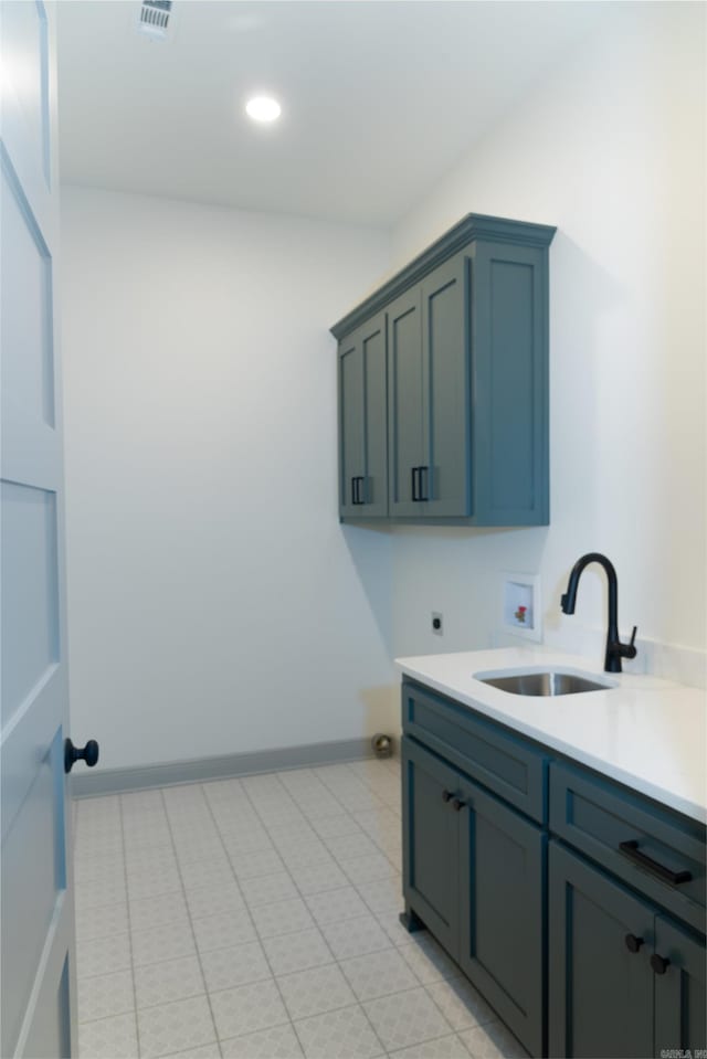 100 Laurie Dr, Mena, AR 71953 - clothes washing area featuring cabinet space, a sink, hookup for a washing machine, baseboards, and electric dryer hookup
