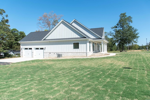 100 Laurie Dr, Mena, AR 71953 - view of side of home featuring an attached garage, a shingled roof, board and batten siding, concrete driveway, and a yard
