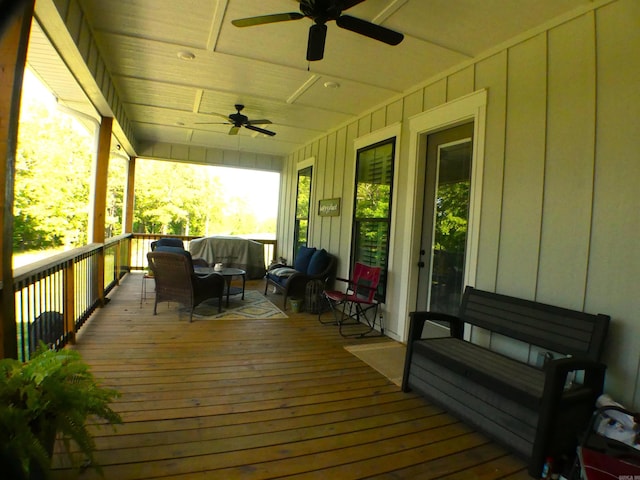 100 Laurie Dr, Mena, AR 71953 - wooden terrace featuring a ceiling fan and an outdoor hangout area